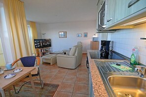 Fridge, stovetop, dishwasher, dining tables