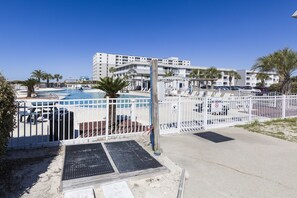 Relax by the pool surrounded by comfortable lounge chairs and umbrellas.