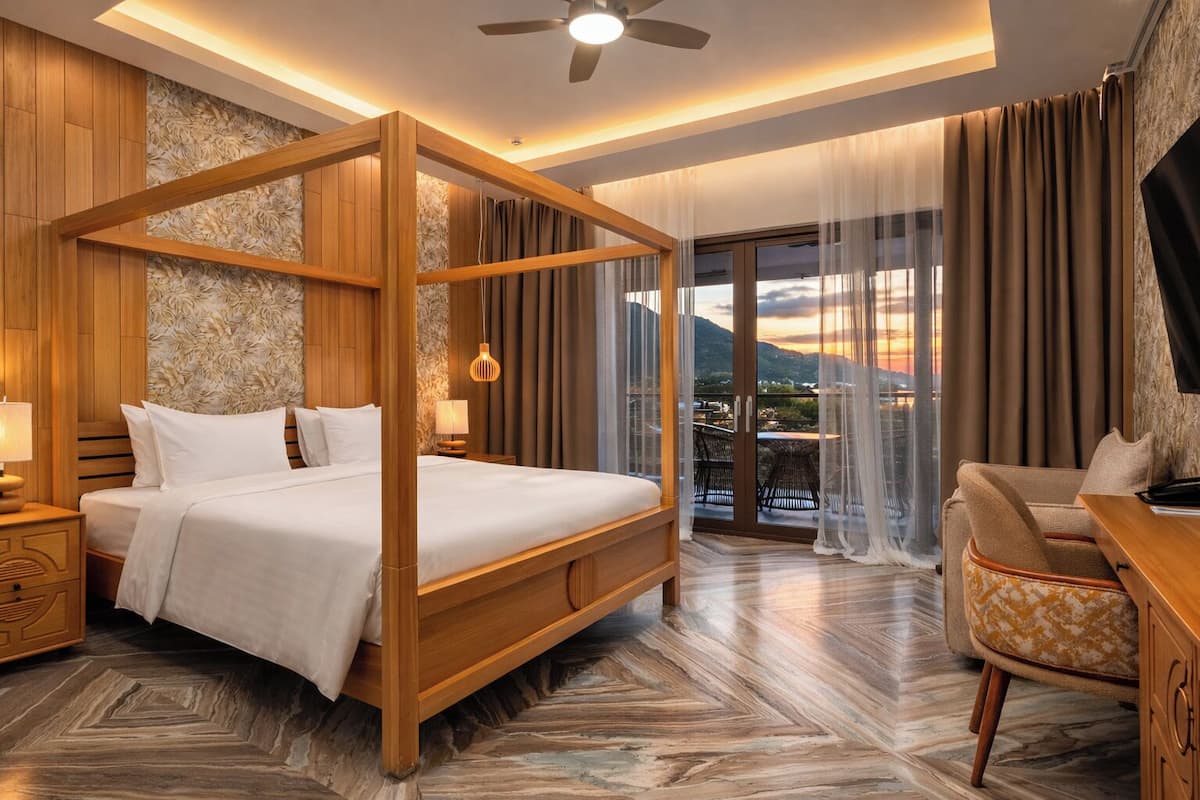 Deluxe Double Room, Balcony, Mountain View | Minibar, in-room safe, soundproofing, iron/ironing board