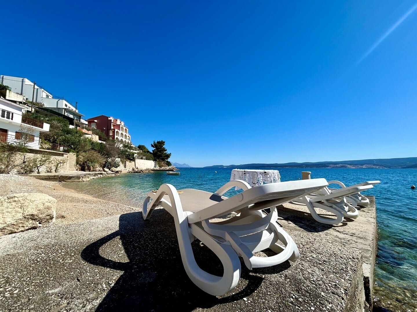 On the beach, sun loungers