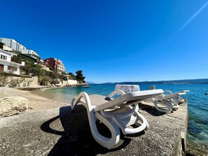 On the beach, sun loungers