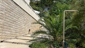 A staircase leading up to a building with a stone facade and a metal railing. - Azure Apartments By The Sea with 3 Bedrooms (Omis)