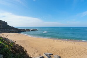 On the beach, sun-loungers, beach towels