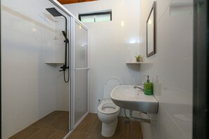 A bathroom with a shower, toilet, sink, and a small window. - The HIJAU Camp & Cabin (Ipoh)