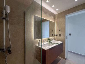 Shower, hair dryer, towels, shampoo