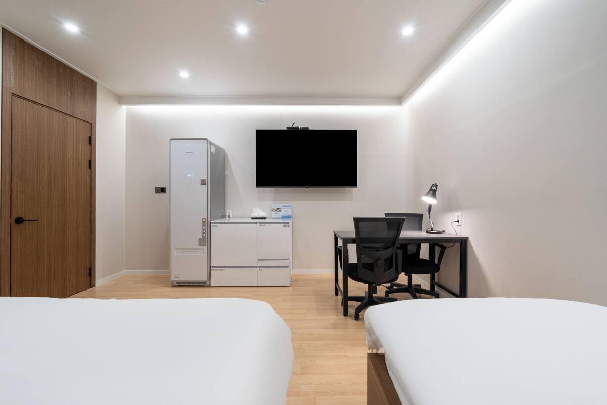 Chambre Deluxe avec lits jumeaux, salle de bain privée | Literie de qualité, couette en duvet, articles de minibar gratuits