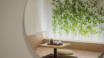 Honeymoon Double Room | Living area | 65-inch Smart TV with digital channels, Netflix, heated floors