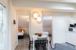 Deluxe Condo | Living area | 40-inch Smart TV with digital channels