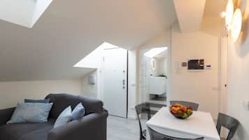 Deluxe Condo | Living area | 40-inch Smart TV with digital channels