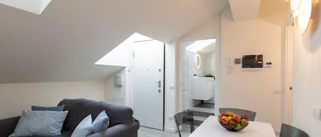 Deluxe Condo | Living area | 40-inch Smart TV with digital channels