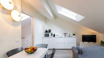 Deluxe Condo | Living area | 40-inch Smart TV with digital channels