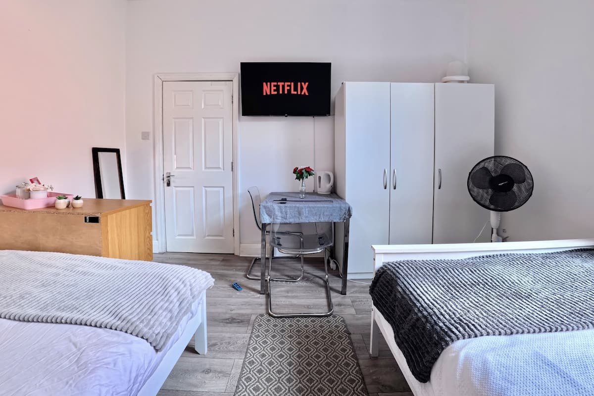 Laptop workspace, free WiFi, bed sheets