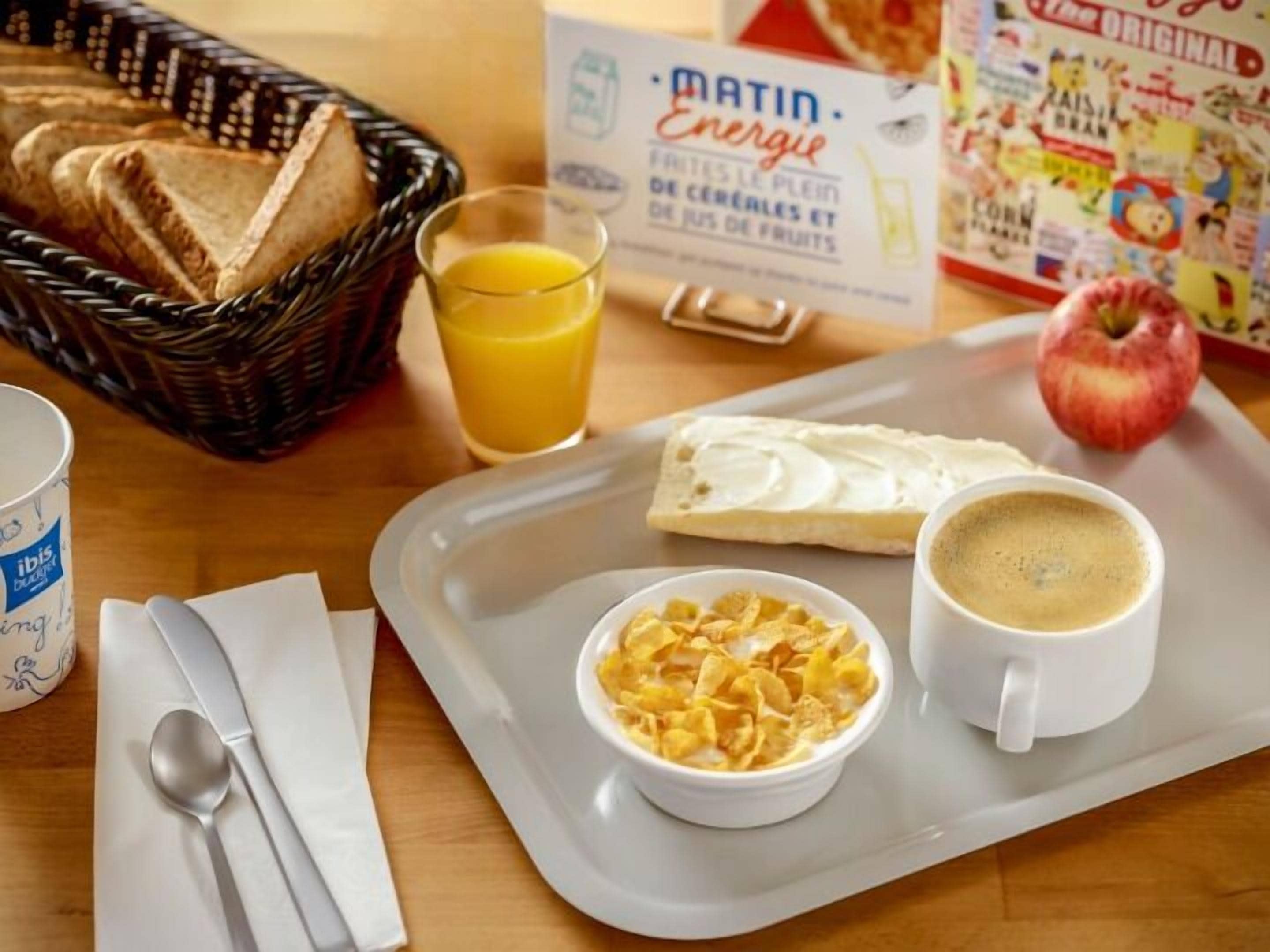 A breakfast tray with toast, cereal, coffee, and juice.