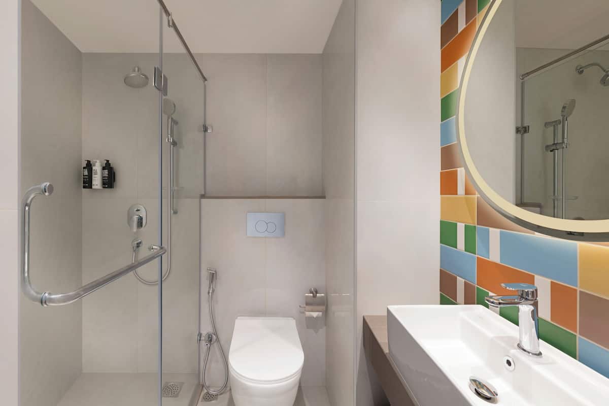 Shower, eco-friendly toiletries, hair dryer, slippers