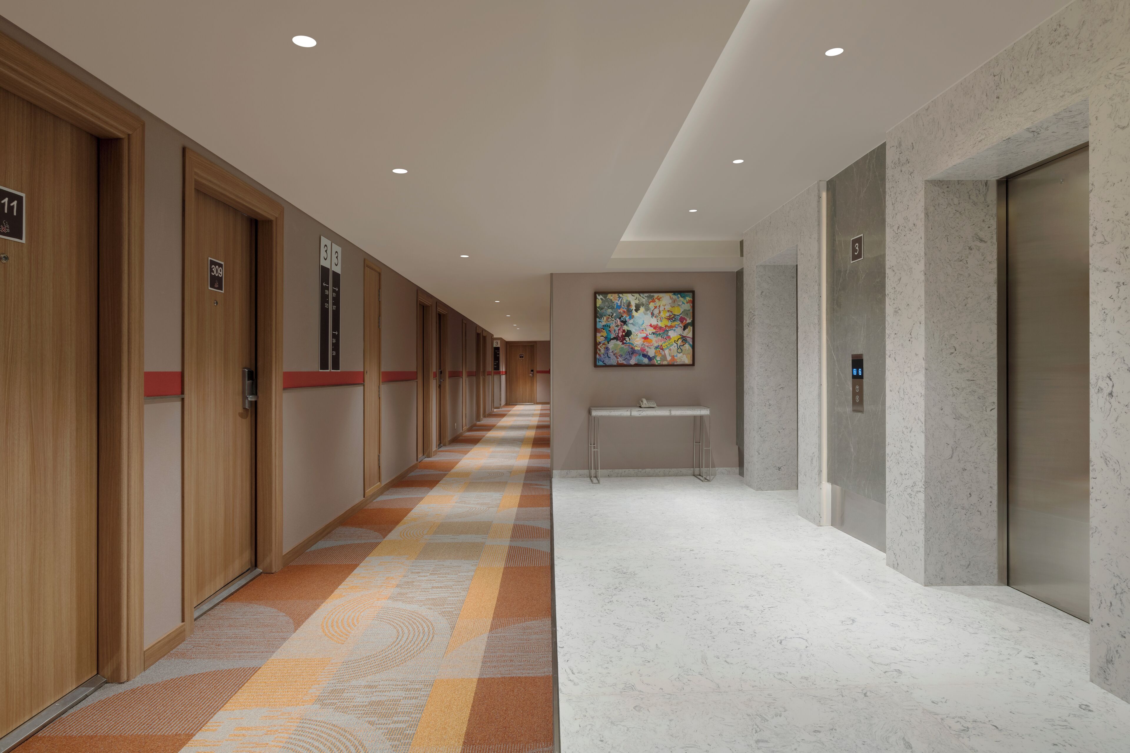 A hotel corridor with wooden doors numbered 11, 39, and 3, a marble floor, and a wall-mounted artwork.
