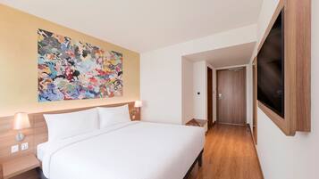 Premium bedding, down comforters, pillowtop beds, minibar