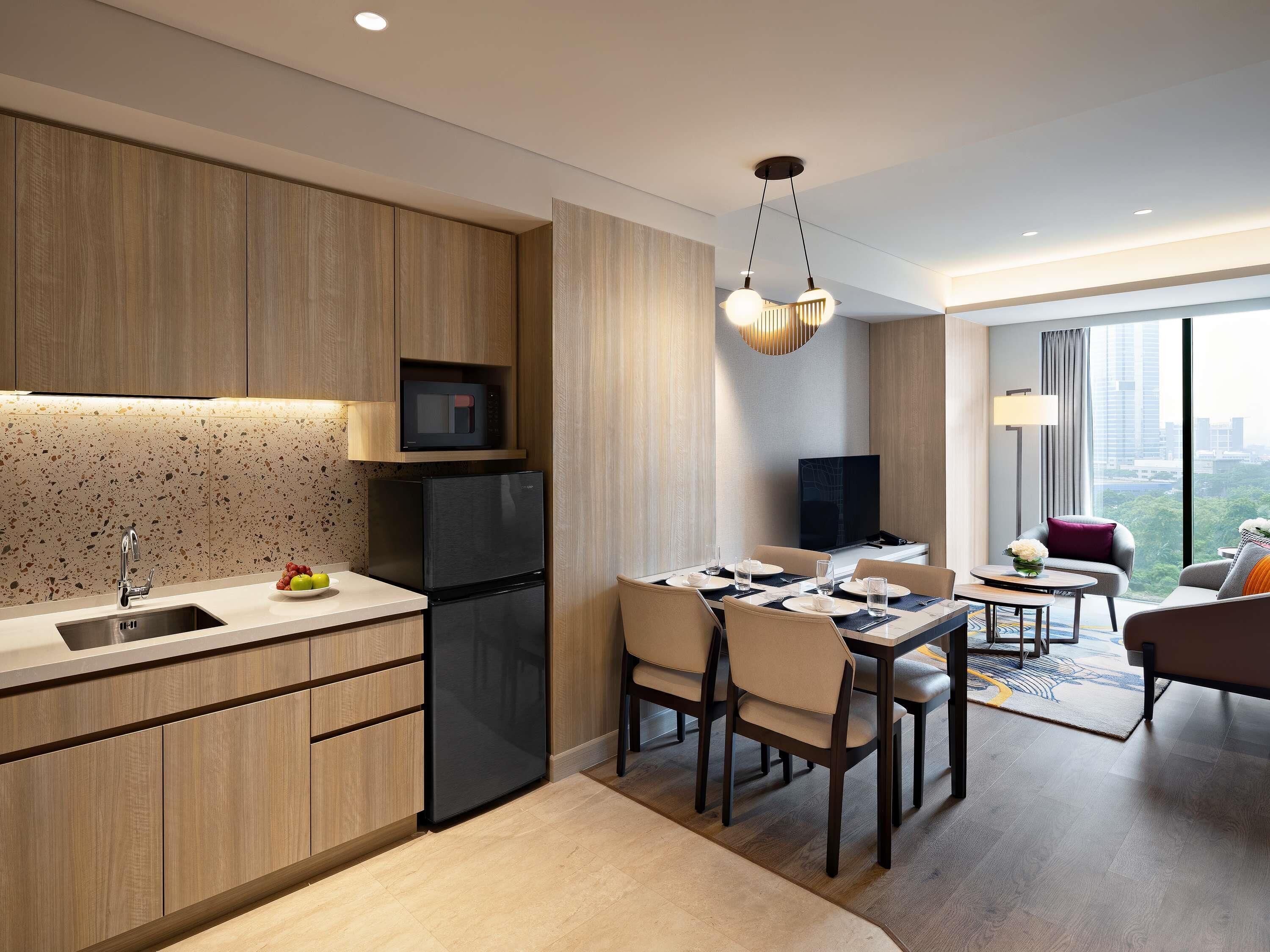 Swiss Advantage One Bedroom Apartment | Living area | 55-inch Smart TV with digital channels, Netflix, streaming services