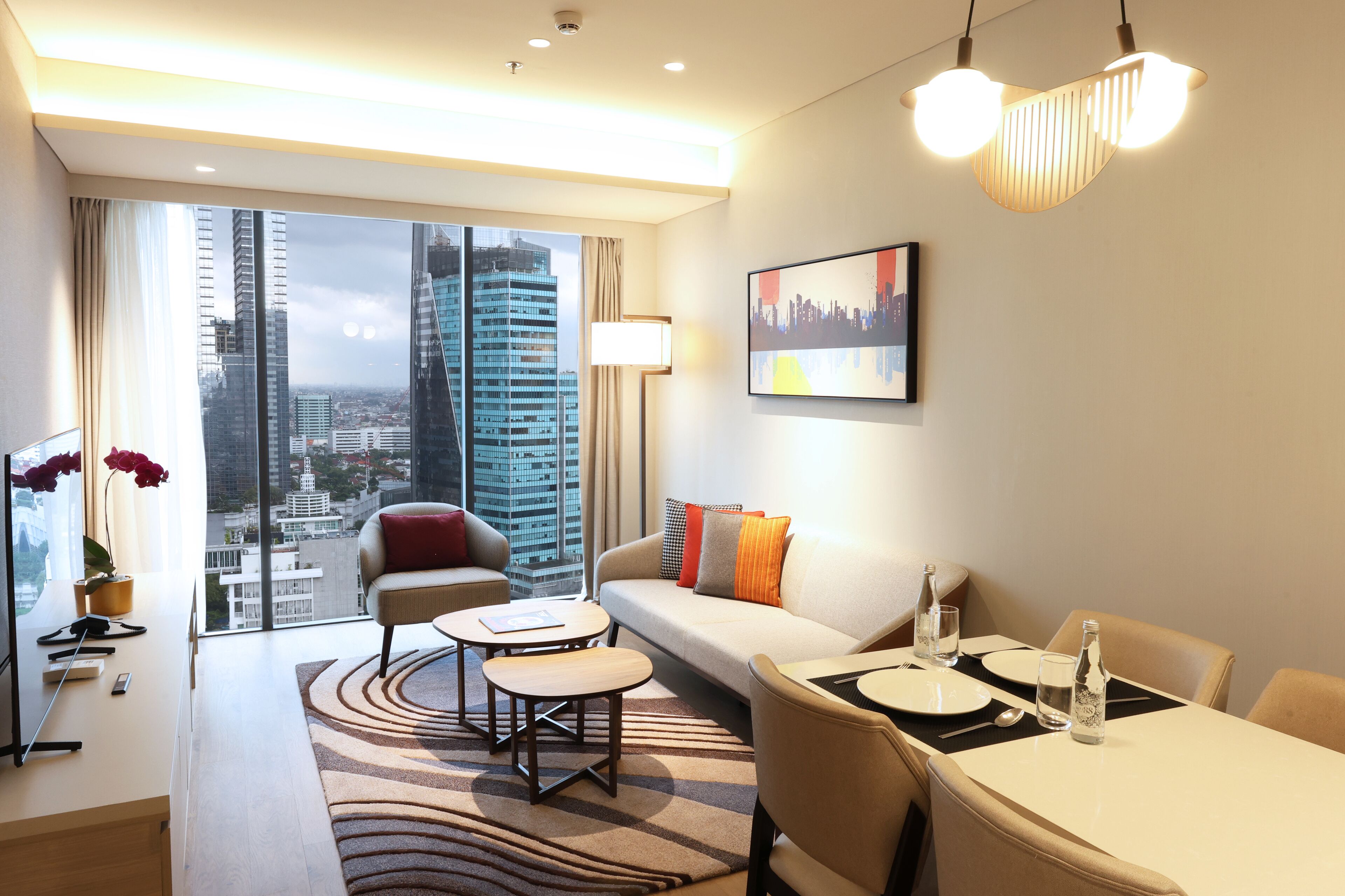 Swiss Executive Suite with King Size Bed | Living area | 55-inch Smart TV with digital channels, Netflix, streaming services