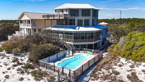A large, multi-story beachfront property with a swimming pool and a covered deck area. - Huge 6 Bdrm/6+ Ba Private GF Home, Pool, Dune Walkover, Easy Access, Gulf Views (Gulf Shores)
