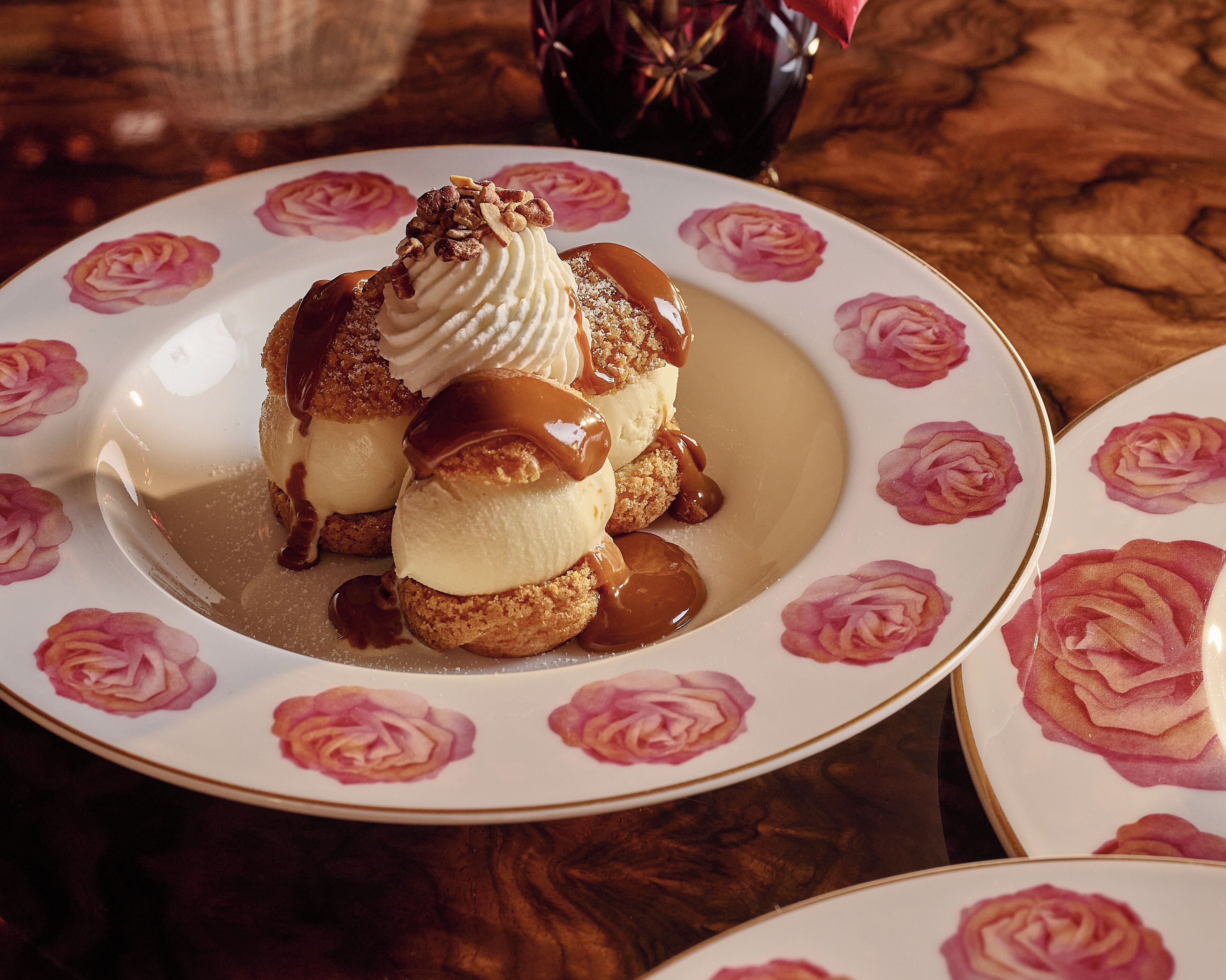 A dessert on a plate with a floral design.