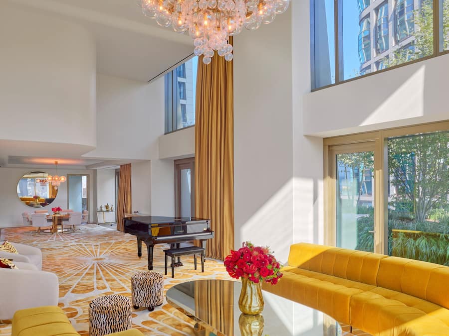 Suite, 3 Bedrooms (Faena) | Living area | 70-inch Smart TV with digital channels