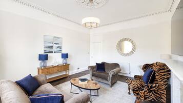 Standard Apartment | Living area | 24-inch flat-screen TV with cable channels, TV