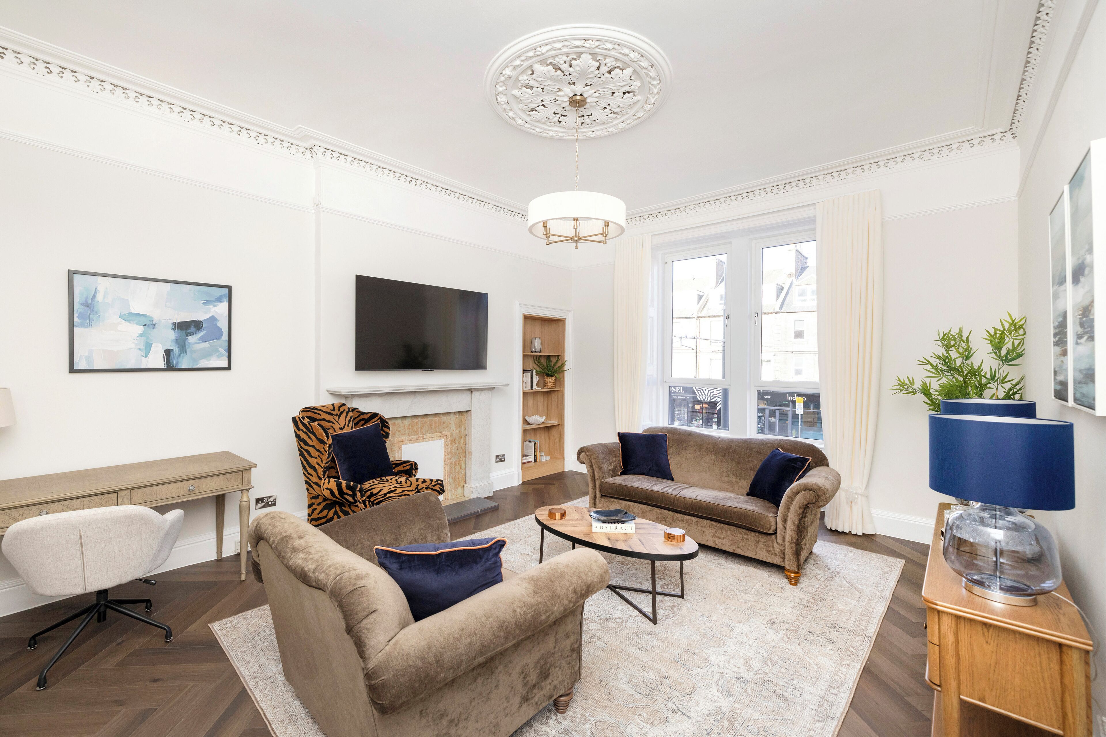 Standard Apartment | Living area | 24-inch flat-screen TV with cable channels, TV