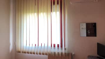 Habitación estándar con 1 cama matrimonial o 2 individuales, vista al jardín | Wifi gratis