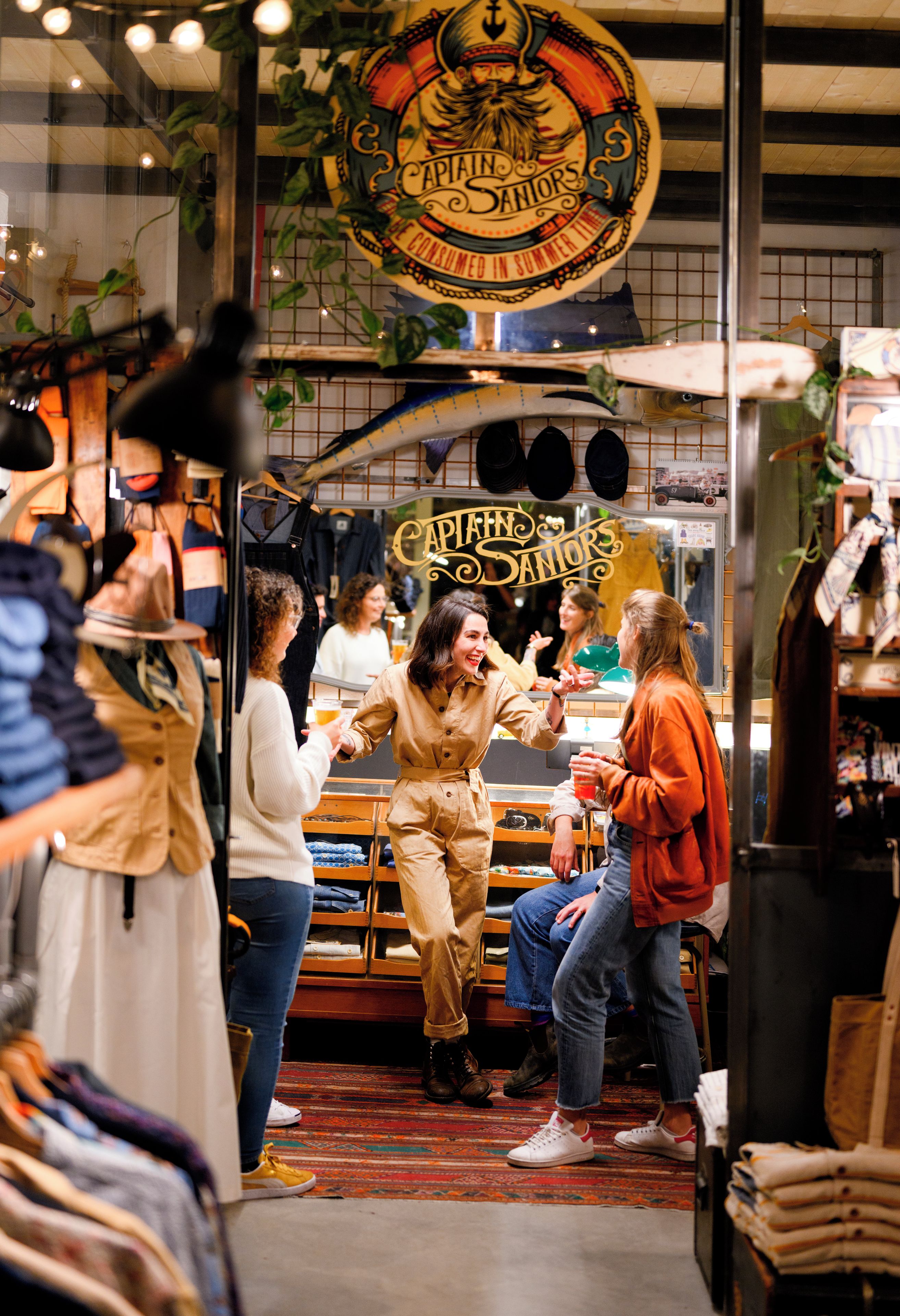 A vintage-themed interior with a prominent sign reading "Captain's Sanors".