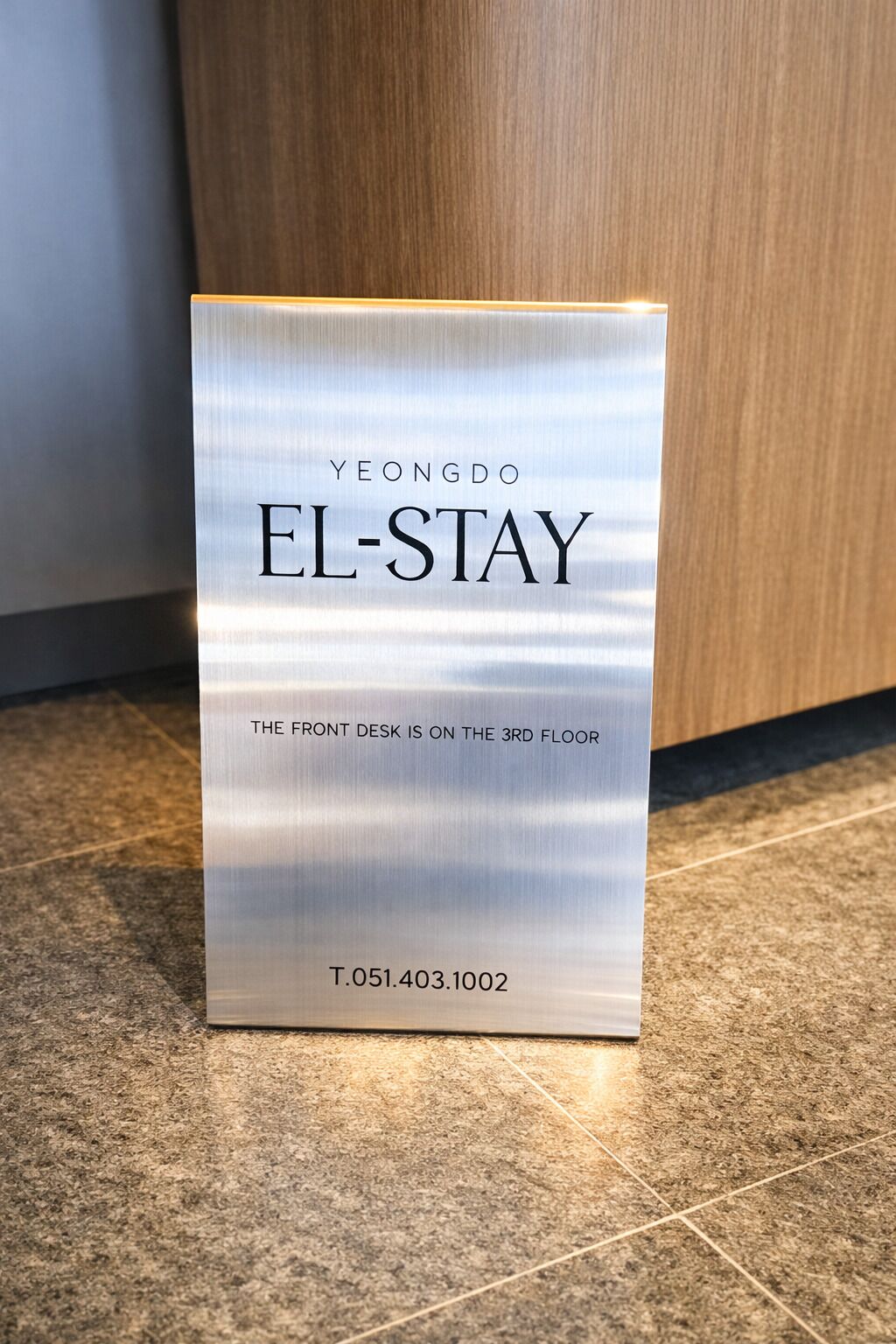 A sign for 'YEONGDO EL-STAY' indicating the front desk is on the 3rd floor.