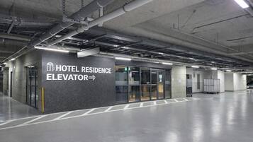 A hotel residence elevator with a sign indicating its location.