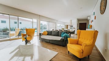 Comfort House, Garden View | Living area | Flat-screen TV