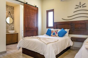 Cozy retreat with a large bed, wooden headboard, and stylish bedside table.