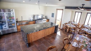 Enjoy cooking and dining in this well-equipped kitchen with a central island and dining area.