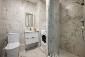 Shower, hair dryer, towels, soap