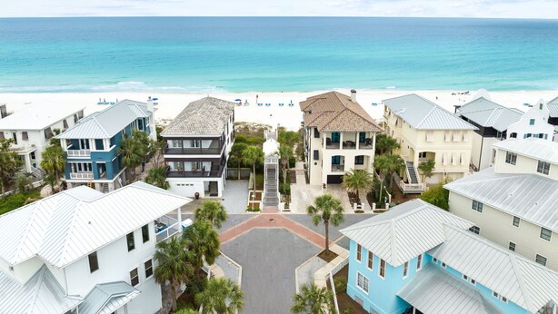 A beachfront property with multiple buildings, a clear view of the ocean, and a sandy beach. - GemStone Cottage! Special Deals! Private Beach, Lux Home w/Free Bch Service! (Panama City Beach)