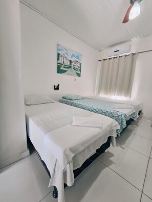 Standard Quadruple Room, Private Bathroom | Free WiFi, bed sheets - Pousada Rio do Prado (Porto Seguro)