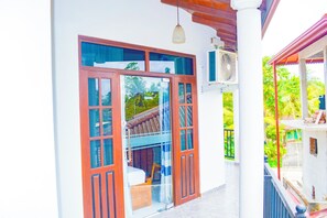 A traditional house with a wooden door and a balcony. - Villa Acadia  (Dharga Town)