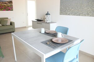 Apartment | Living area | 24-inch flat-screen TV with satellite channels