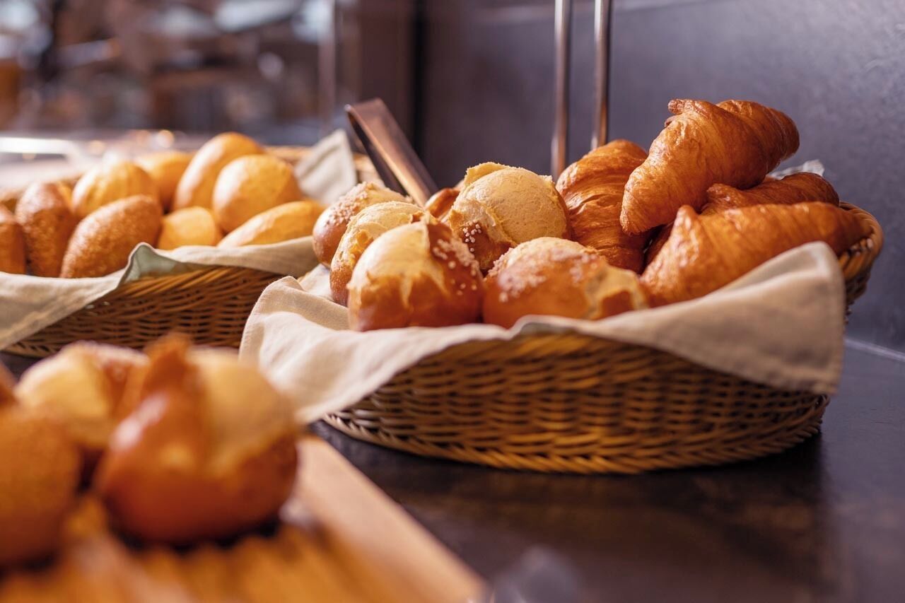Baskets of assorted baked goods on a counter.