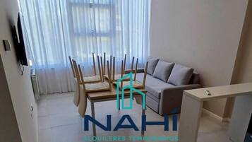 Apartment, City View | Living area | 43-inch Smart TV with digital channels