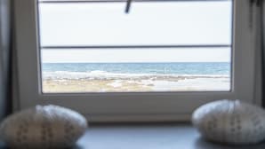 A window with a view of the sea.