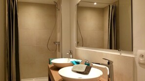 Shower, hair dryer, towels, toilet paper