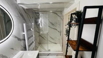 Shower, hair dryer, towels, soap