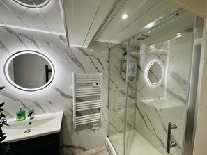 Shower, hair dryer, towels, soap