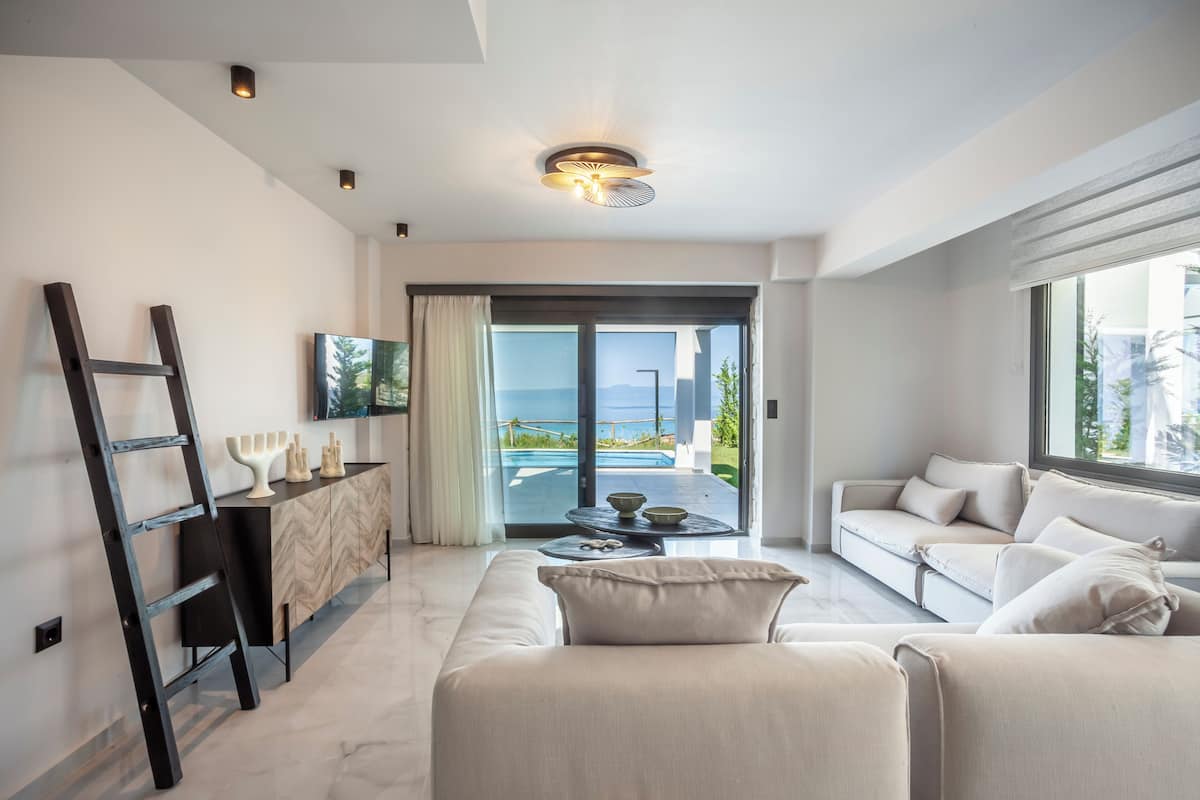 Sunshine Luxury Villa | Living area | 42-inch TV with satellite channels