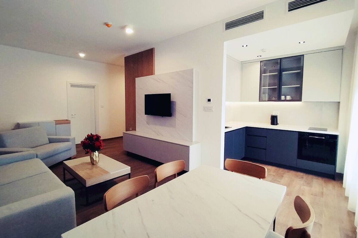 Deluxe Apartment | Living area | 40-inch LED TV with digital channels