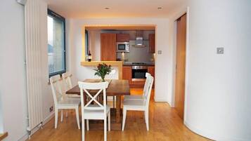 Standard Apartment | Living area | 24-inch flat-screen TV with cable channels, TV