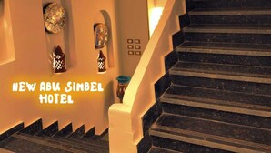 A staircase leading to a room with a sign reading "NEW ABU SIMBEL HOTEL". - New Abusimble Hotel (Abu Simbel)