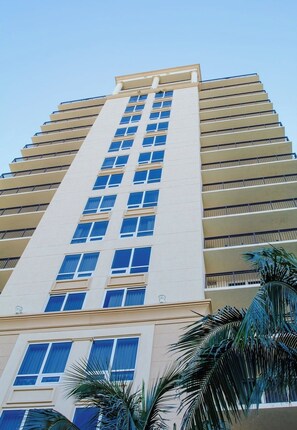 A tall, multi-story hotel with a beige facade, large windows, and balconies. - Ocean view! 2bd at The Palm Beach Resort and Spa (Riviera Beach)